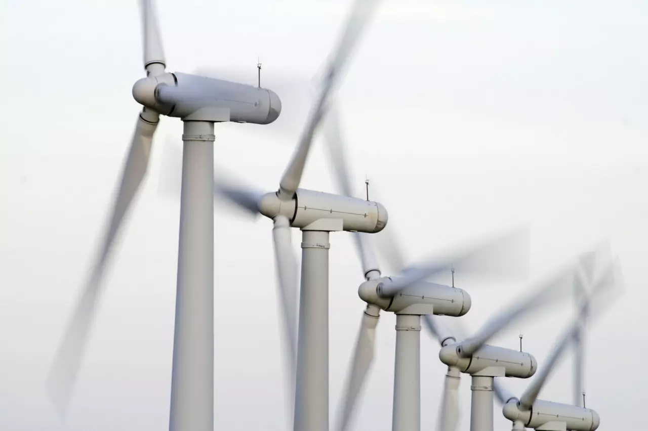 Close up of wind turbine blades rotating on a wind farm