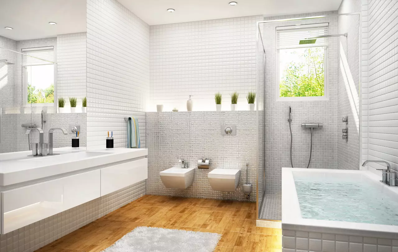 Modern white tile bathroom with separate tub and shower cubicle.