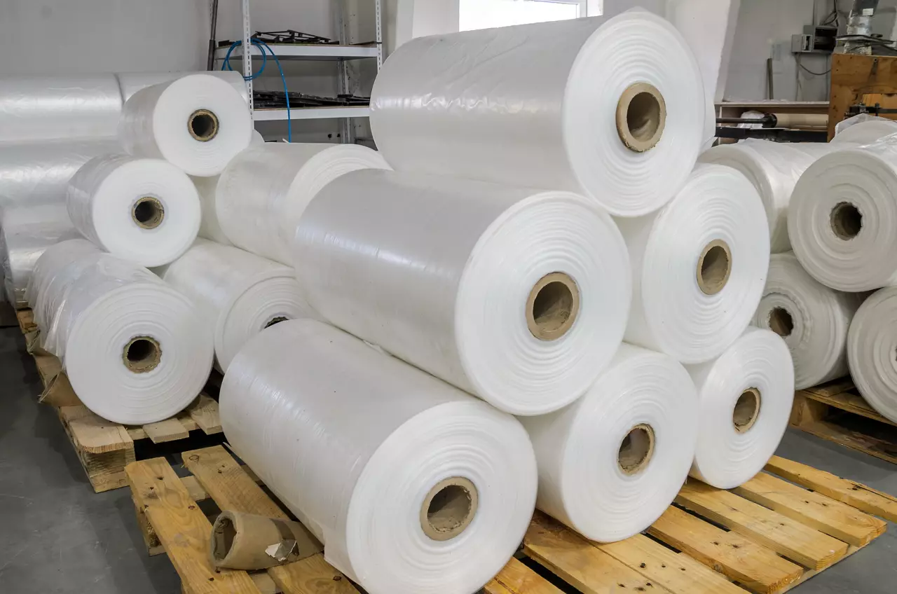 Warehouse with rolls of polyethylene on pallets