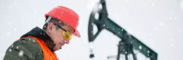 Oil drill in oil and gas field with pump jack and worker 
