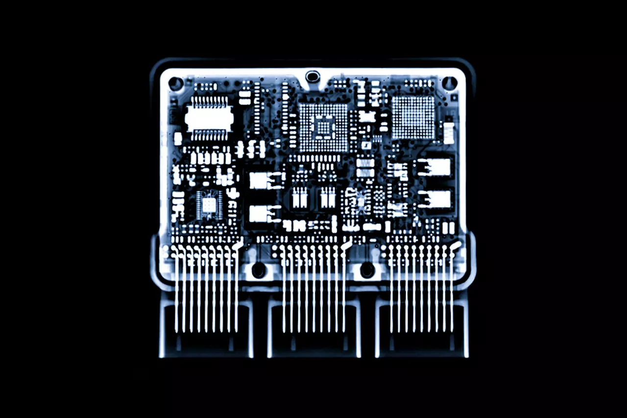 close up X-ray image of engine control unit or ECU in Motorcycle is a type of electronic control unit that controls a series of actuators on an internal combustion engine to ensure optimal engine performance.