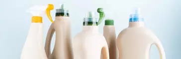 Close-up of cleaning products on blue white background overview 