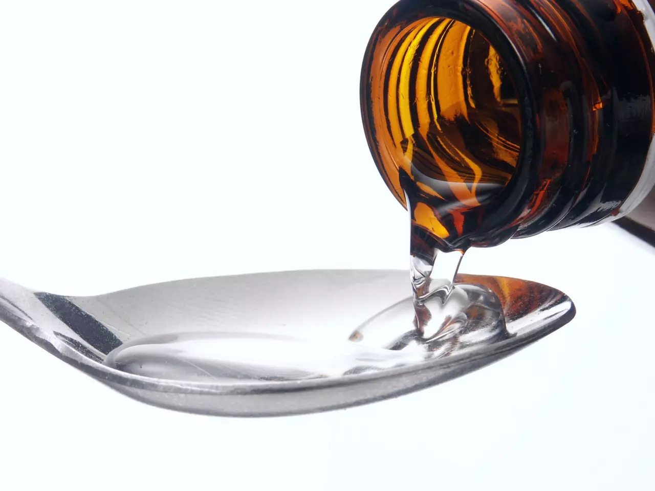 Serving medicine syrup on a spoon