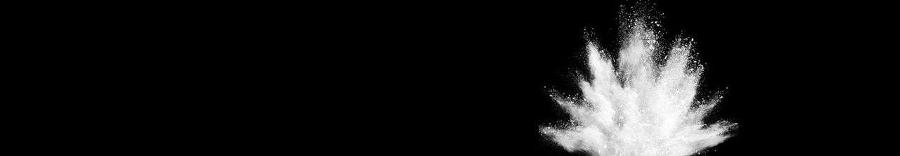 white catalyst powder on black background