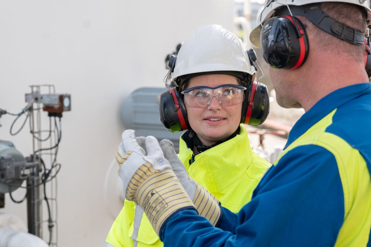 Two workers at factory