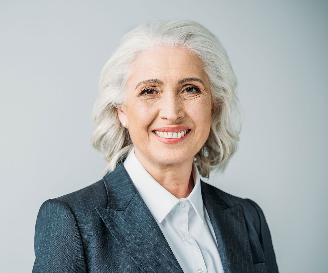 woman with white hair smiling