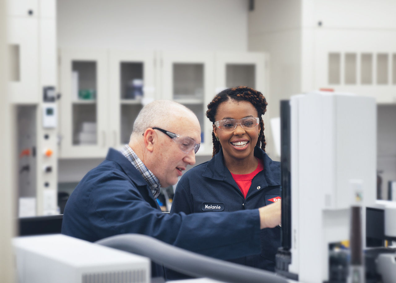 Melanie Robinson in the lab with a colleague