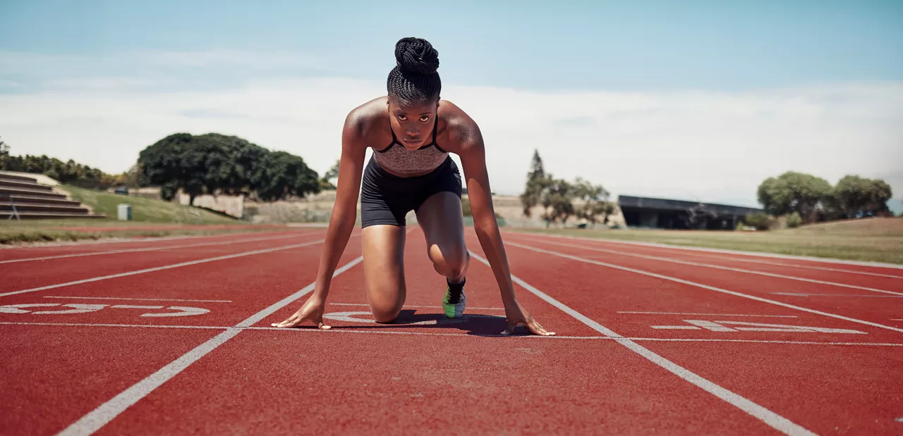 Woman preparing to race on a track