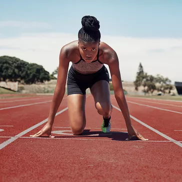 Woman preparing to race on a track