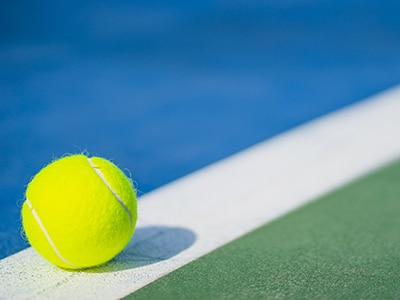 closeup of a tennis ball on a tennis court
