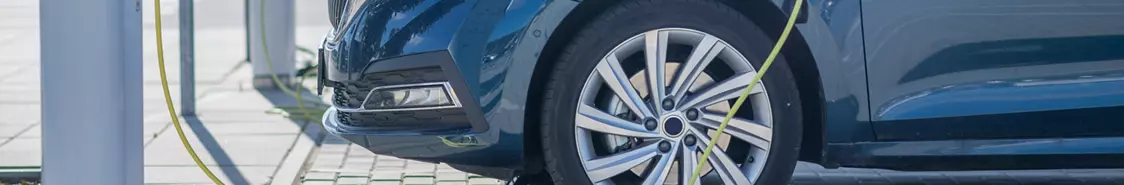 Cars plugged in at a public charging station