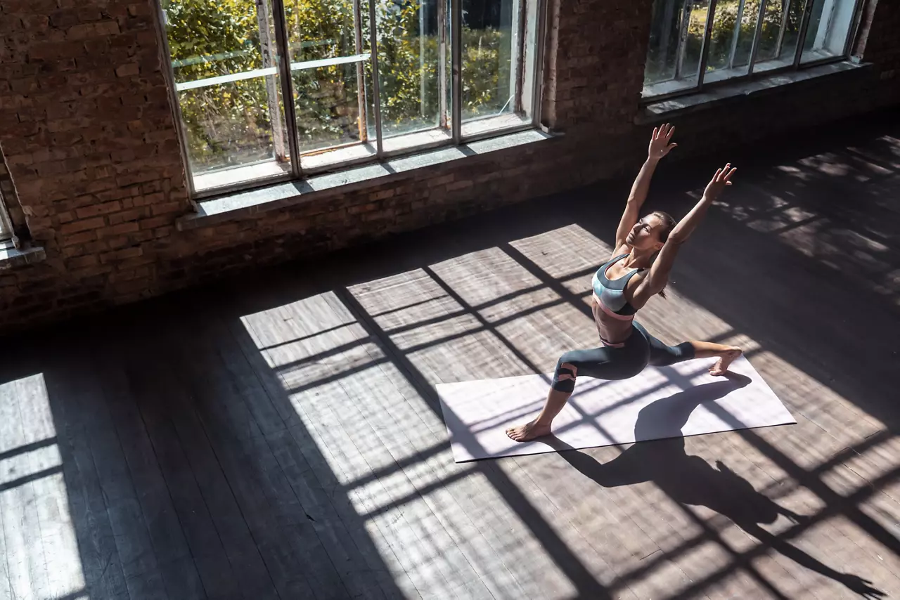Woman doing yoga in a gym studio